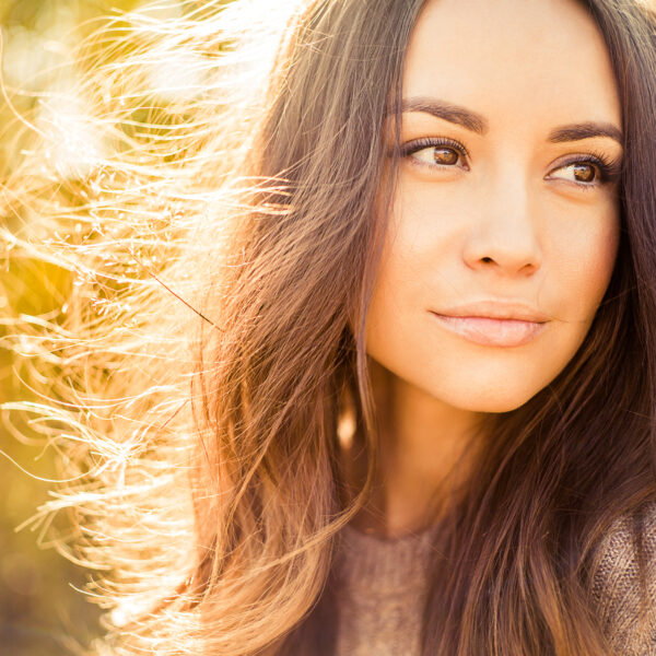Outdoor atmospheric fashion photo of young beautiful lady in autumn landscape