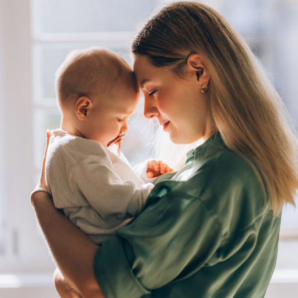 The profound connection between a loving mother and her baby, a serene snapshot of the beauty and tenderness of motherhood.